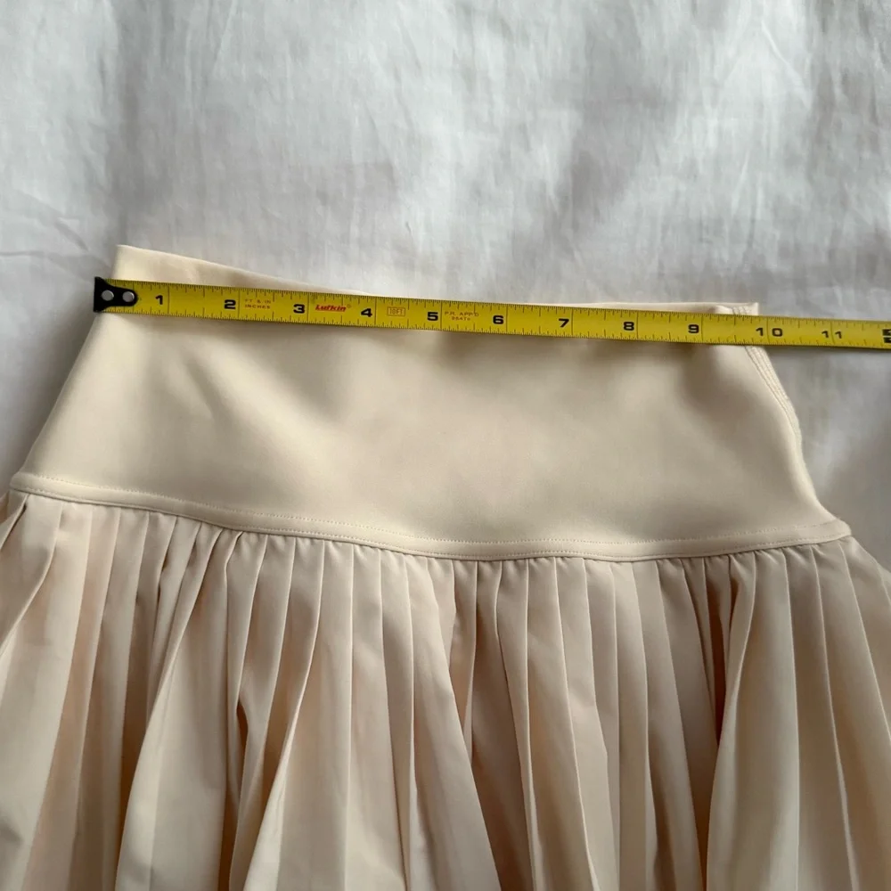 ALO Grand Slam Pleated Tennis Skirt Yoga in butter yellow xxs